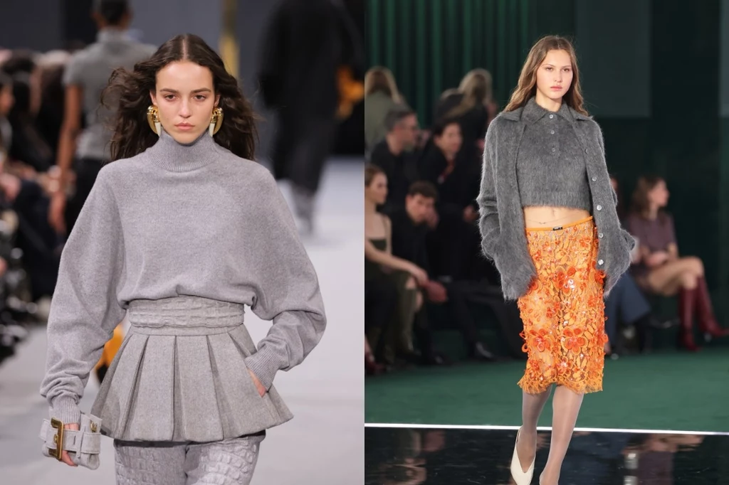 Balmain, Gucci jesień/zima 2025-2026. Fot. Richard Bord, Daniele Venturelli Dwie modelki prezentują jesienno-zimowe stylizacje, z lewej szeroki szary golf z plisowaną spódnicą, z prawej krótki sweter w odcieniu szarości oraz pomarańczowa spódnica z aplikacjami, tło wypełniają siedzący widzowie pokazu mody.