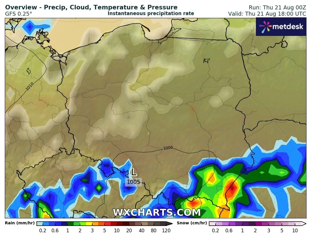 mapa Polski przedstawiająca prognozę opadów, chmur, temperatury i ciśnienia na tle konturowym państwa, intensywne opady widoczne są na południu kraju w postaci kolorowych stref niebieskich, zielonych i żółtych, reszta obszaru pozostaje sucha pod lekkim...