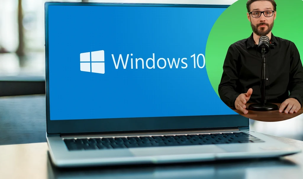 Bezpieczeństwo w sieci to najważniejszy czynnik, który powinien motywować do aktualizacji systemu operacyjnego Laptop z włączonym systemem Windows 10 na ekranie, w prawym górnym rogu okrągłe wklejenie mężczyzny z mikrofonem, sugerujące prowadzenie prezentacji lub nagrania.