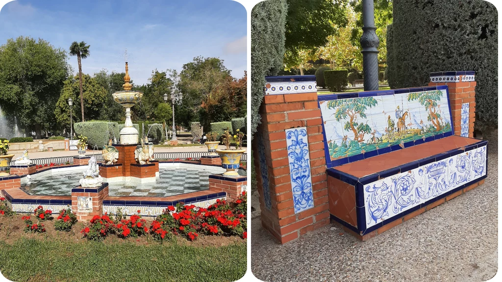 Ozdobna fontanna otoczona rabatą kwiatową i dekoracyjna ławka z kafelkami prezentującymi scenę krajobrazową, elementy architektury ogrodowej wśród roślinności i drzew.