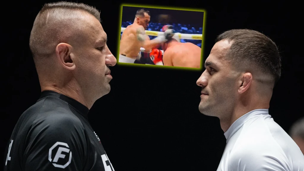 FAME MMA: Adamek - Soldić Dwóch sportowców stoi naprzeciw siebie w bliskiej odległości, skoncentrowani i przygotowani do walki, w tle widoczna jest wstawka z dynamiczną sceną bokserską.