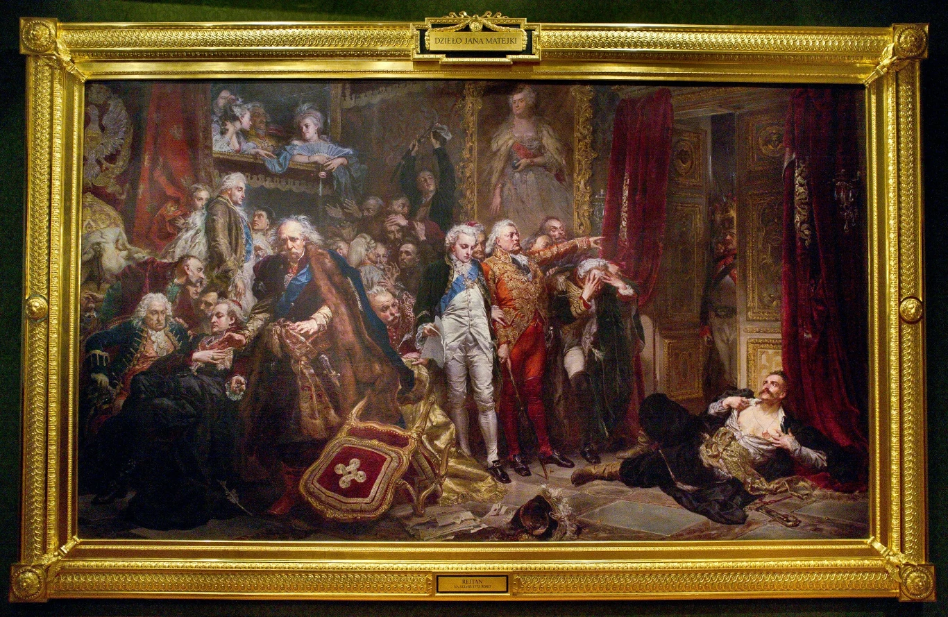 Nadia Tarkowska z Ostatniego Pokolenia obnażyła piersi pod obrazem Tadeusza Rejtana w Zamku Królewskim, naśladując historyczny gest. Grupa mężczyzn w historycznych strojach zgromadzona w bogato zdobionym wnętrzu podczas dramatycznego wydarzenia politycznego; w centrum postacie w wyraźnym ruchu i ekspresji emocjonalnej, część osób na pierwszym planie wykazuje oznaki rozpaczy lub napi...
