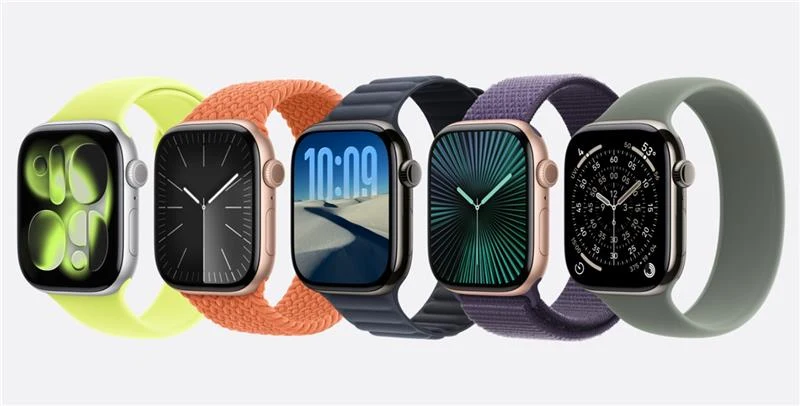 Pięć nowoczesnych smartwatchy z różnorodnymi paskami i wyświetlaczami ustawionych obok siebie na jasnym tle, prezentujących różne kolory pasków i tarcze zegarków.