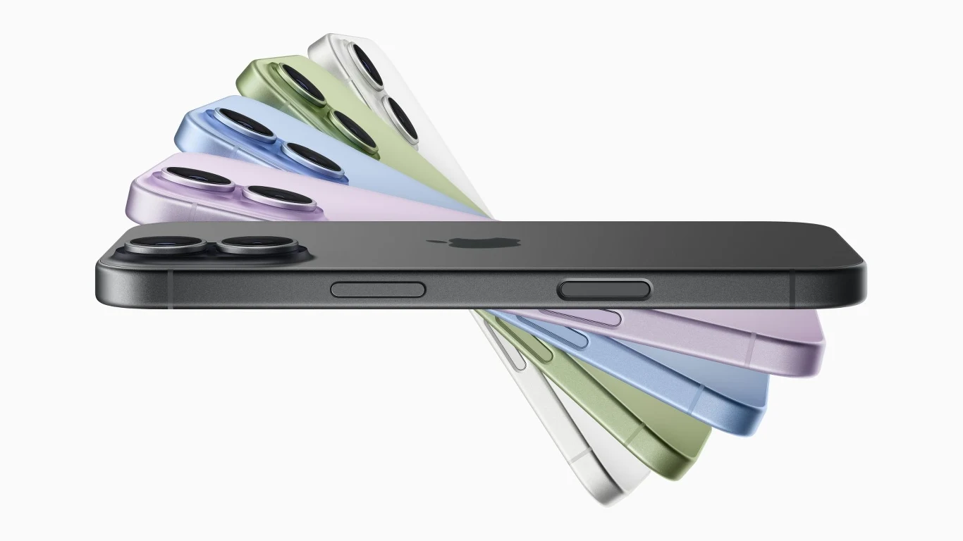 Różnokolorowe modele nowoczesnych smartfonów ustawione wachlarzowo na białym tle, eksponujące metaliczne wykończenie oraz podwójną kamerę główną.
