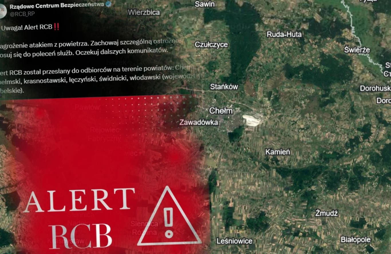 Alert RCB dla części mieszkańców województwa lubelskiego Mapa regionu z wyraźnym czerwonym komunikatem Alert RCB oraz ostrzeżeniem o zagrożeniu powietrznym dla wybranych powiatów, nałożonym na zdjęcie satelitarne okolic Chełma i pobliskich miejscowości.