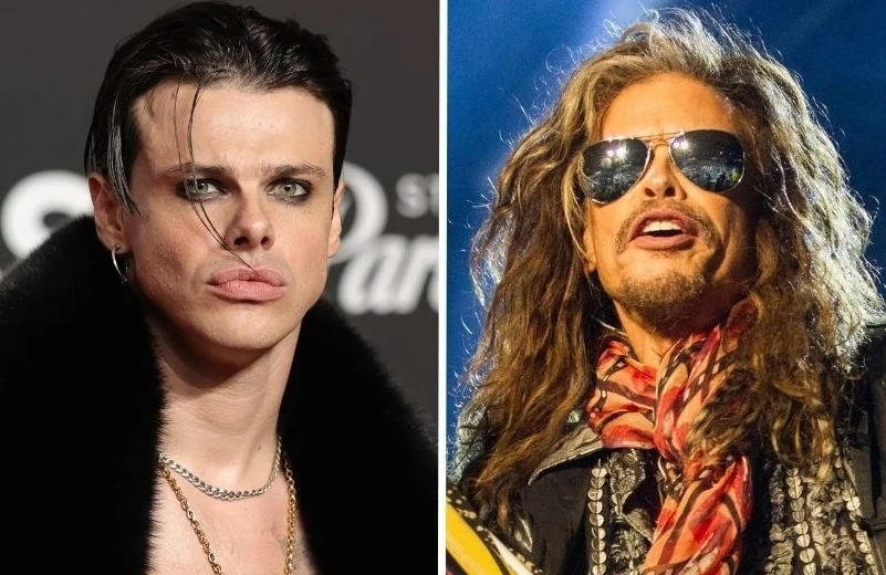 Yungblud podjął współpracę z Aerosmith Po lewej stronie młody mężczyzna z wyrazistym makijażem oczu i krótką fryzurą, w ciemnym futrze i z łańcuszkiem na szyi. Po prawej stronie starszy mężczyzna z długimi włosami, noszący okulary przeciwsłoneczne i kolorową apaszkę, uśmiechnięty.