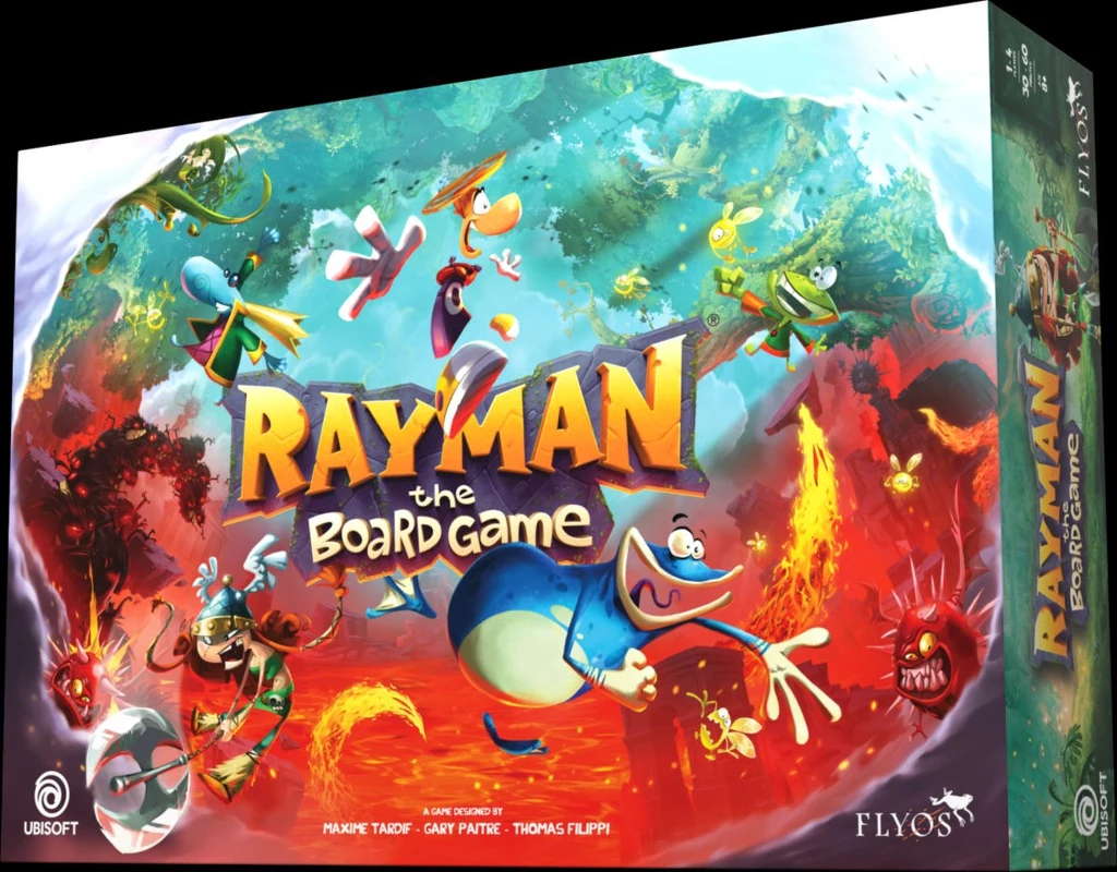Kolorowa okładka gry planszowej Rayman the Board Game z dynamicznymi postaciami z uniwersum Raymana w fantastycznym, bajkowym otoczeniu, pełnym latających stworzeń, roślin i żywych kolorów. Na pierwszym planie widoczne są postacie z gry otoczone efekta...