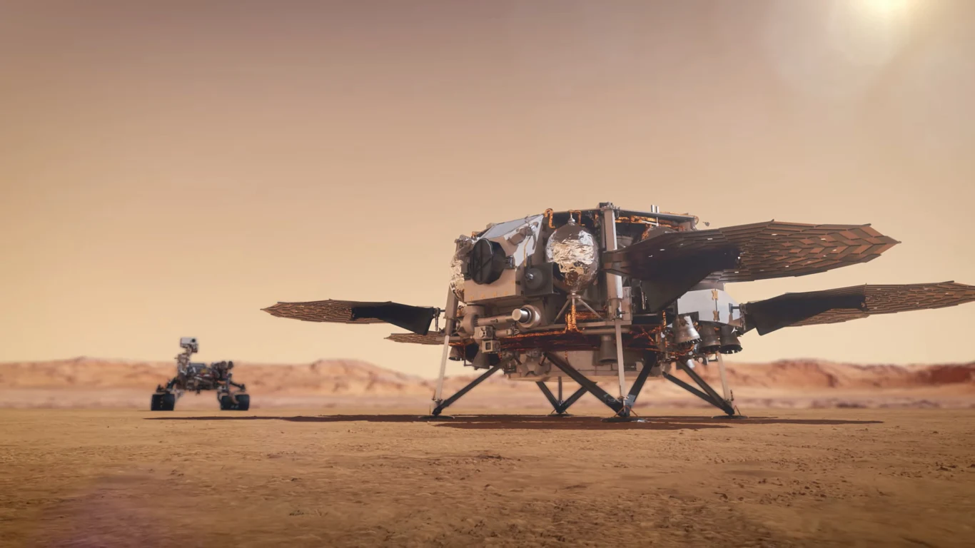 Mars Sample Return. Kto pierwszy sprowadzi próbki z Marsa na Ziemię? Lądownik i łazik marsjański na powierzchni Marsa, rozciągający się krajobraz o czerwonawym zabarwieniu, widoczne detale konstrukcyjne pojazdów, słoneczne światło pada na scenę z prawego górnego rogu.