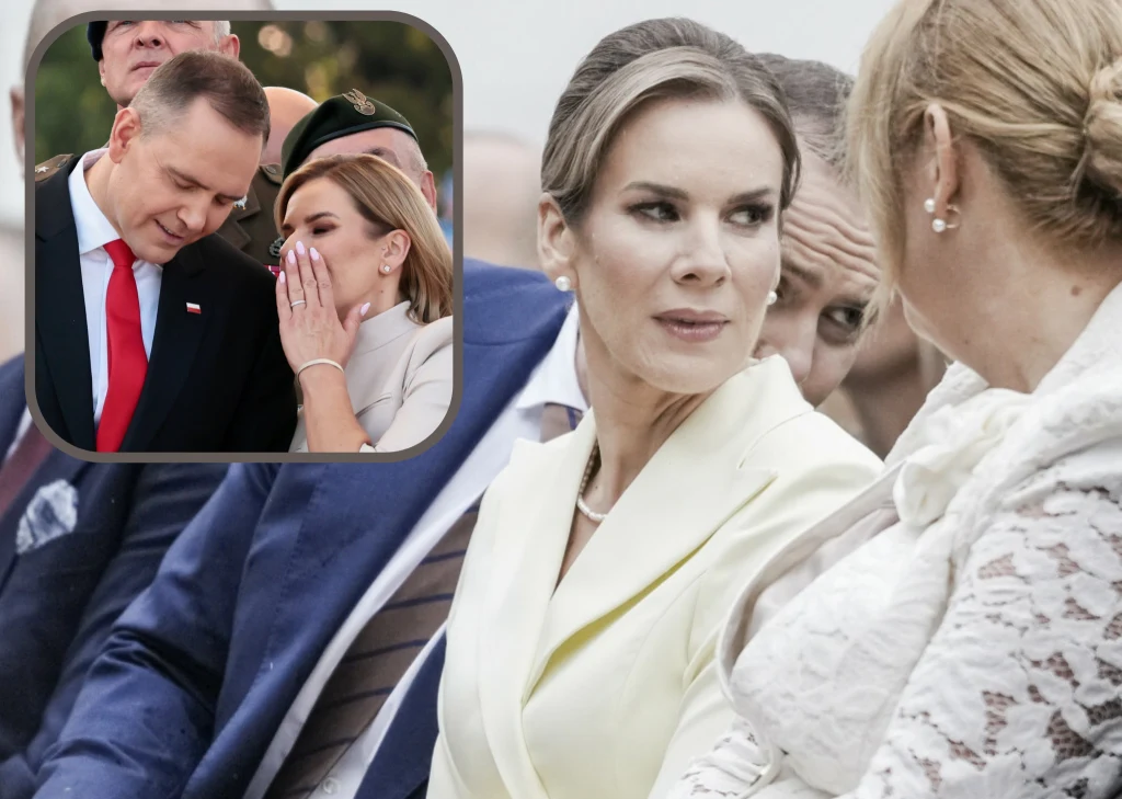 Grupa elegancko ubranych osób podczas wydarzenia oficjalnego, w centralnej części kobieta w jasnym stroju patrzy w bok z poważnym wyrazem twarzy, obok niej kobieta w białej marynarce, w tle mężczyźni w garniturach, na wstawce mężczyzna w czerwonym kraw...