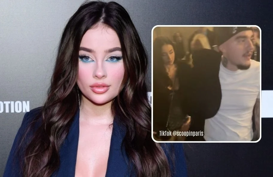 Młoda kobieta z długimi, ciemnymi włosami i mocnym makijażem stoi na tle ciemnej ścianki, obok widoczna jest wstawka z nagrania przedstawiającego grupę osób w klubie nocnym.