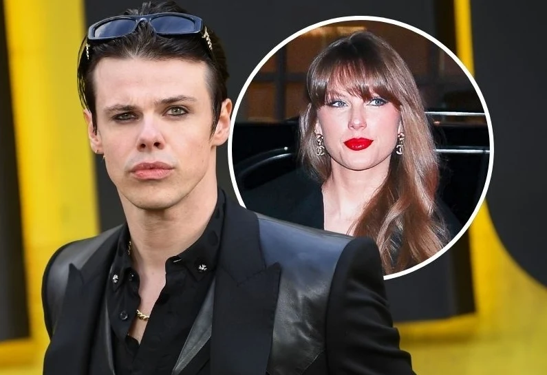 Yungblud stanął w obronie Taylor Swift Dwójka znanych osób, mężczyzna z ciemnymi włosami w czarnej skórzanej kurtce i okularach przeciwsłonecznych na głowie stoi na pierwszym planie, w tle widoczna okrągła ramka ze zdjęciem kobiety o długich brązowych włosach i mocno podkreślonych czerwonyc...