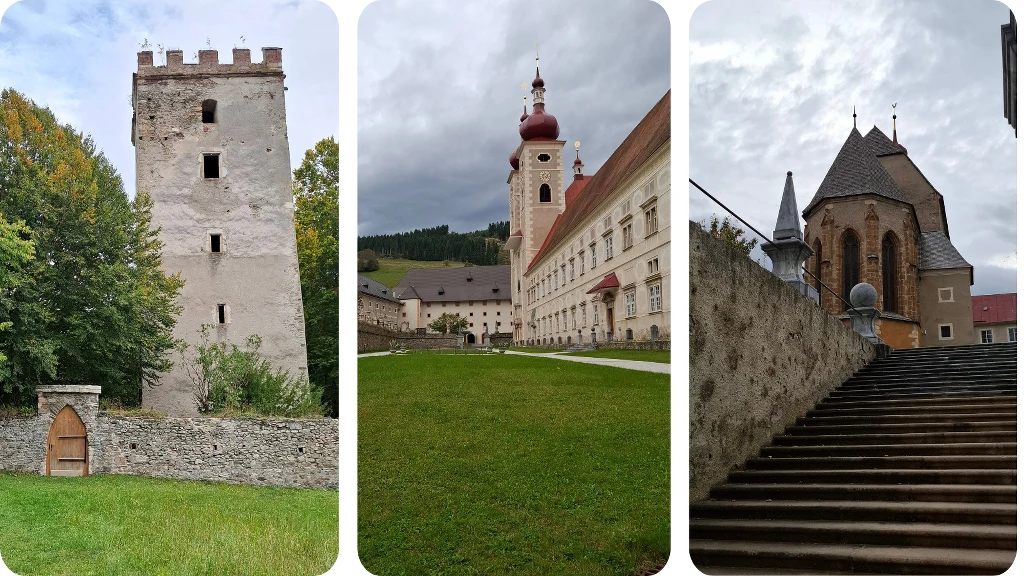 Kamienna wieża obronna otoczona zielenią, długi, jasny budynek klasztorny z czerwonym dachem i kopułą przy kościele oraz monumentalna świątynia widoczna z perspektywy schodów, wszystko w otoczeniu przyrody i historycznej zabudowy.