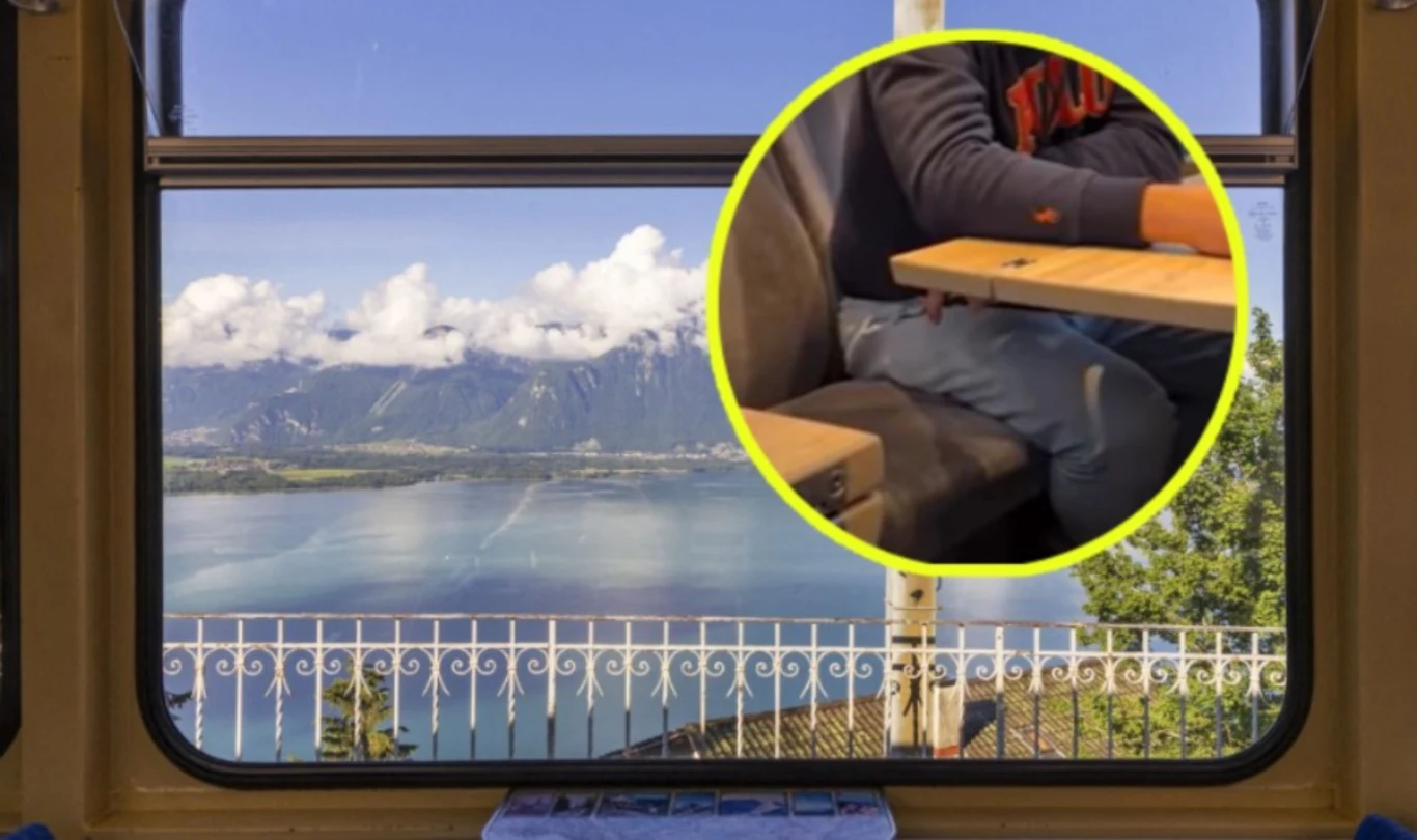 MSZ Ukrainy zareagowało na nagranie ze szwajcarskiego pociągu Widok na jezioro i góry przez okno pociągu, w którego wnętrzu znajduje się osoba siedząca przy stoliku, skupiona na swoich rękach.