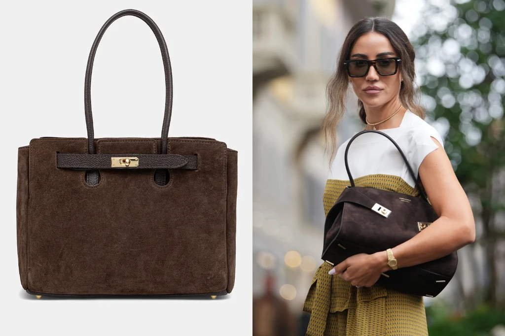 Brązowa torebka ze skóry z długimi uchwytami, ozdobnym zapięciem i metalowym detalem, trzymana przez kobietę ubraną elegancko, stojącą na tle miejskiej scenerii.