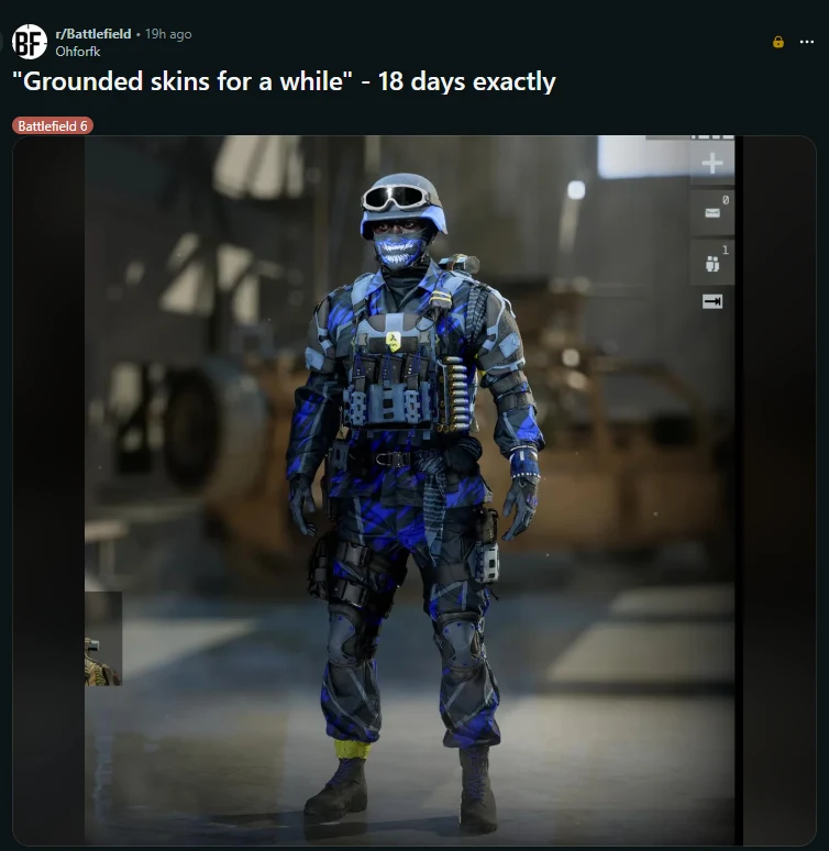 źródło zdjęcia: Reddit Postać żołnierza w niebieskim i czarnym mundurze taktycznym ze wzorem maskującym oraz maską na twarzy, z białym uśmiechem i ciemnymi okularami, stojąca w hangarze lub magazynie z rozmytym tłem.