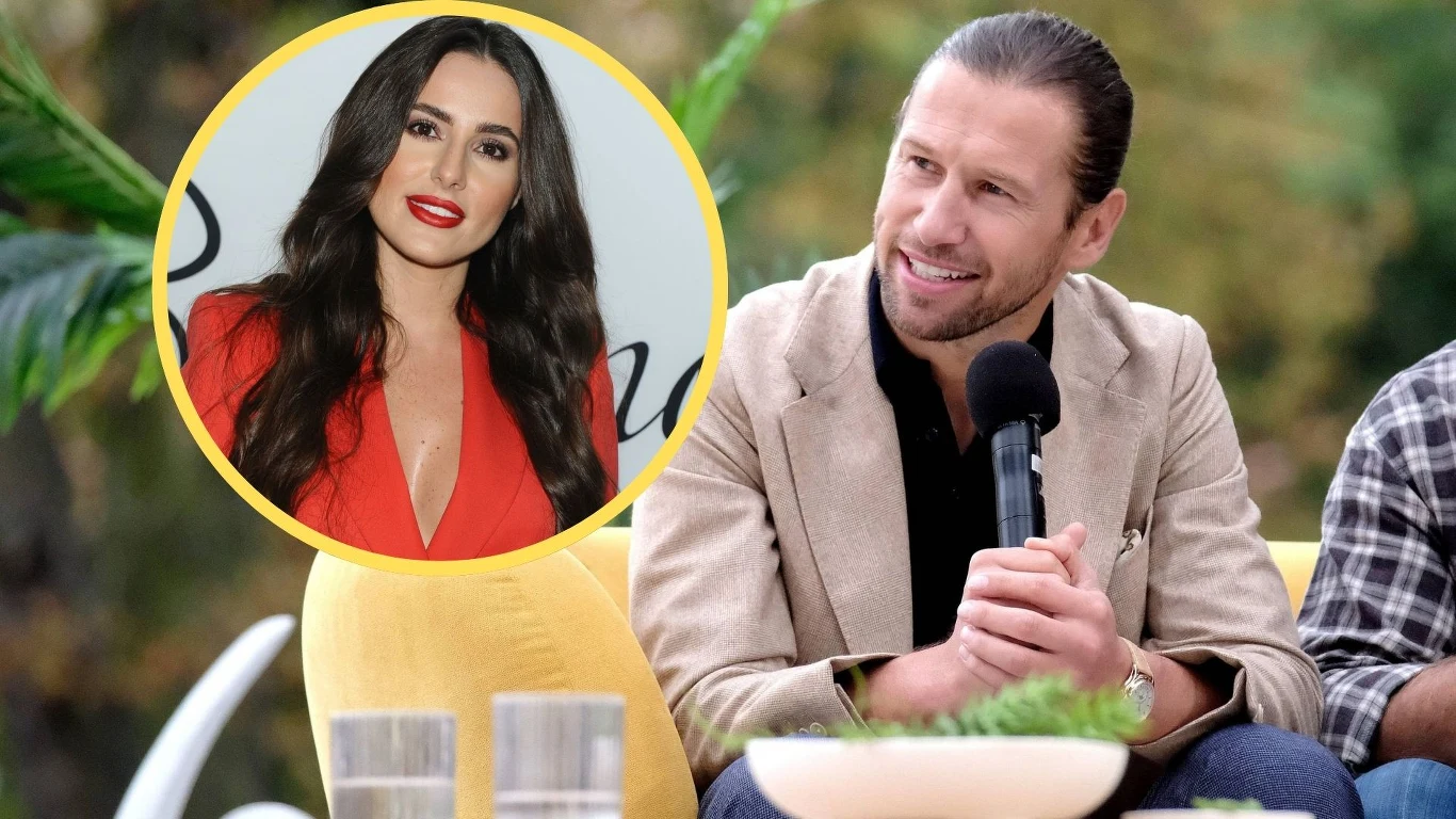 Grzegorz Krychowiak i jego żona Celia Mężczyzna z mikrofonem siedzi przy stole w otoczeniu zieleni, uśmiecha się i rozmawia z innymi. W lewym górnym rogu widoczna jest okrągła wstawka z portretem kobiety w czerwonej sukience.