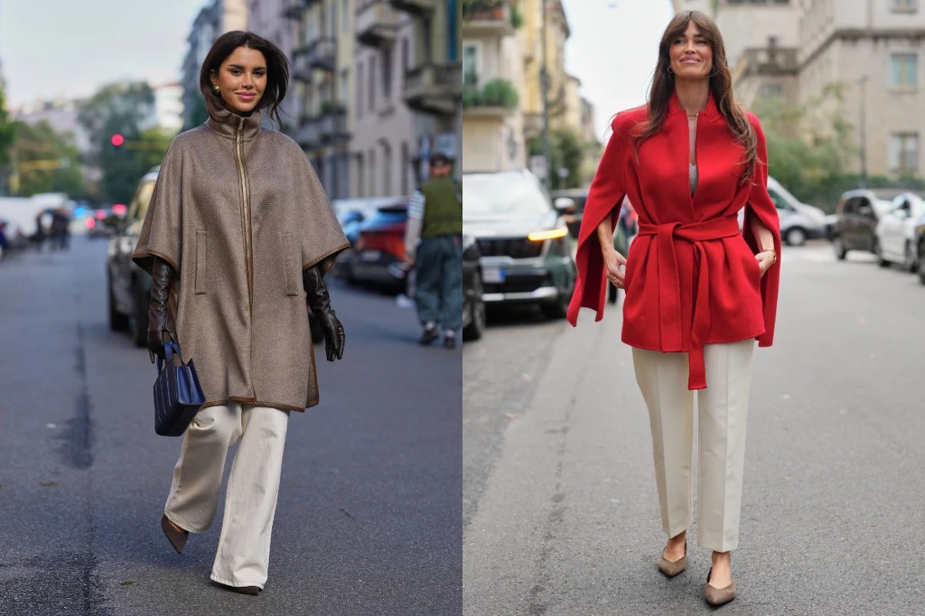 Białe spodnie jesienią. Jak je nosić? Fot. Edward Berthelot Dwie kobiety spacerujące po mieście, obie ubrane elegancko w jasne spodnie i okrycia wierzchnie – jedna w beżowe ponczo, druga w czerwony płaszcz z paskiem w talii. Kobiety prezentują modne, jesienne stylizacje, tło stanowi miejska ulica z samochodami ...