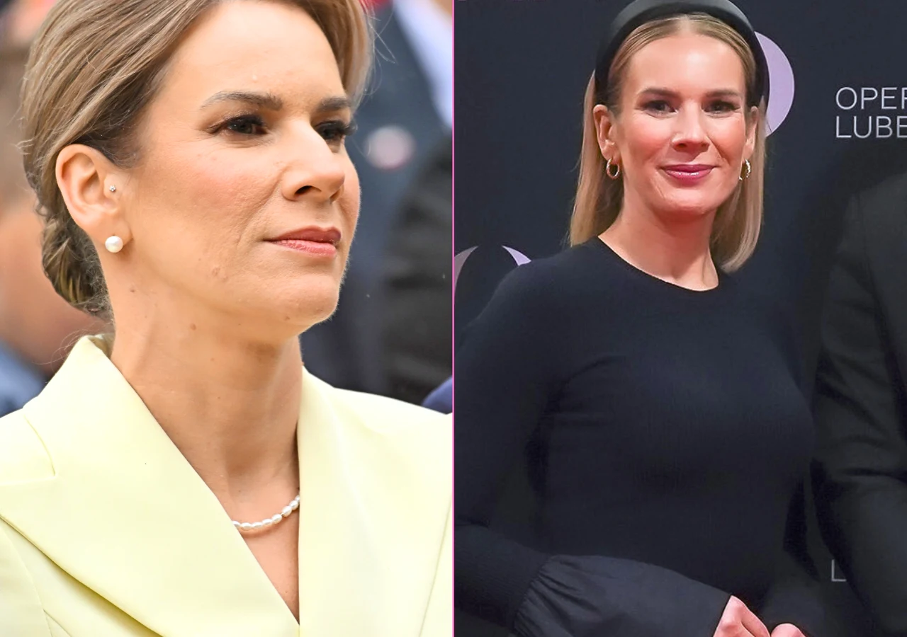 Marta Nawrocka Dwie eleganckie kobiety, jedna w jasnym żakiecie i perłowym naszyjniku, druga w ciemnej stylizacji z długimi rękawami i złotymi kolczykami, obie z upiętymi włosami i lekkim makijażem, stoją na tle formalnego wydarzenia.