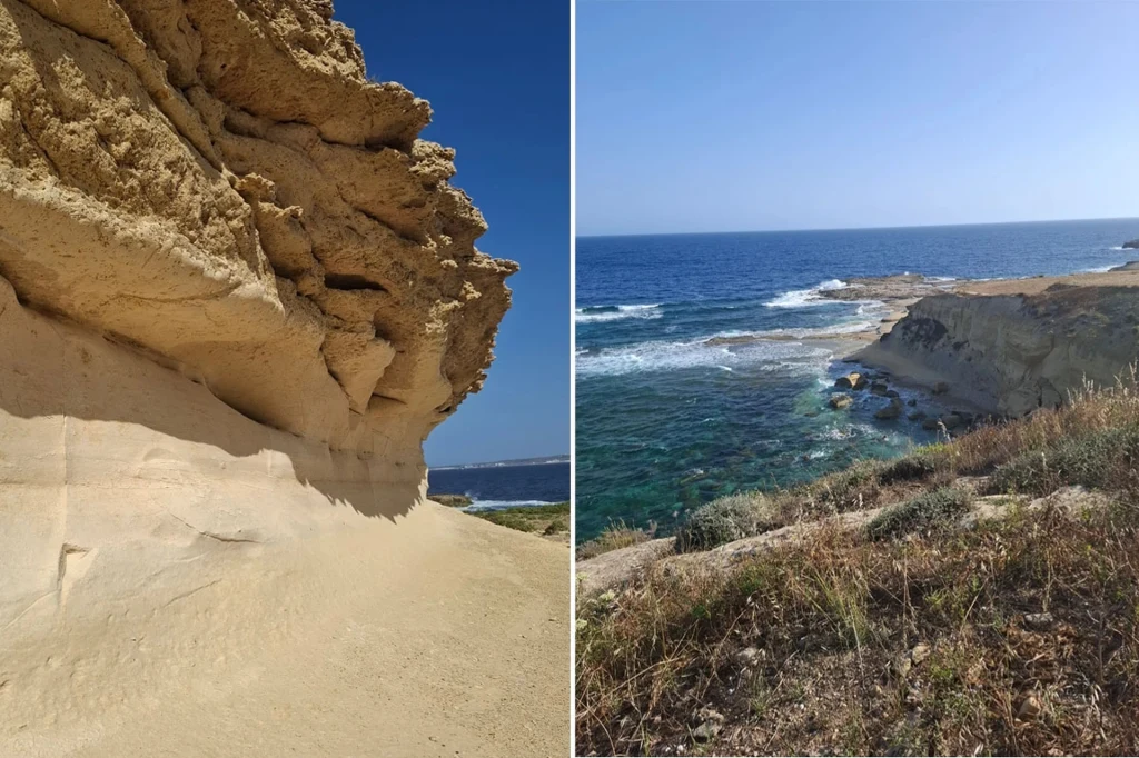 Szlak Costal Walk na Gozo Skały o jasnym, piaskowym kolorze oraz urwiste klify przy brzegu morza, błękitna woda i fale rozbijające się o brzeg, sucha roślinność przy urwisku, wyraźne niebo bez chmur.