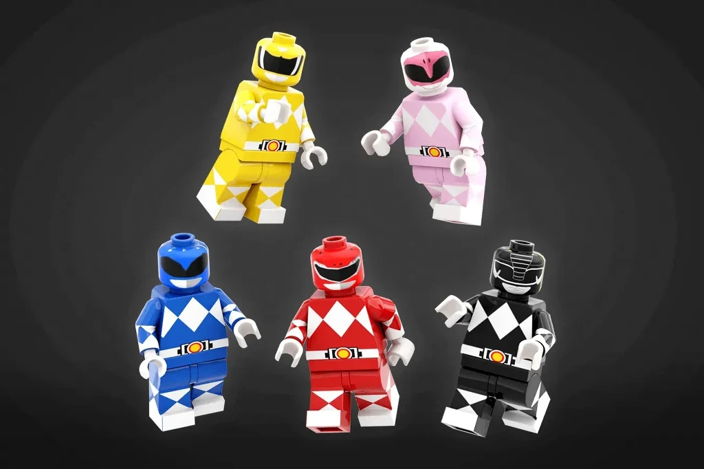 W skład zestawu LEGO Megazord wchodzić będą także figurki wojowników Pięć figurek LEGO w kolorowych kostiumach w stylu Power Rangers ustawionych na tle o ciemnej barwie, każda z unikalnym kolorem zbroi: żółtym, różowym, niebieskim, czerwonym i czarnym.