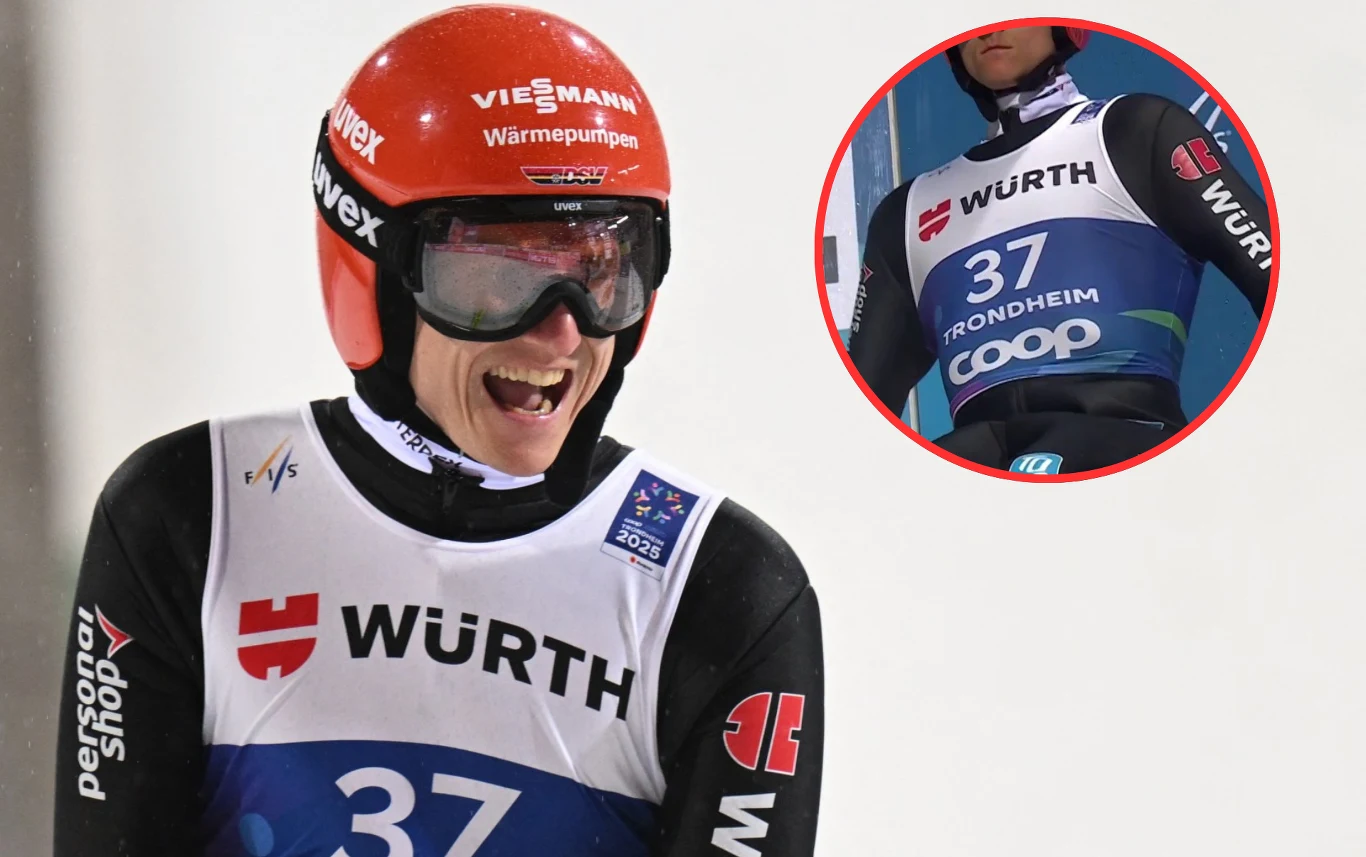 Uśmiechnięty skoczek narciarski w kasku i goglach, ubrany w profesjonalny kombinezon z numerem 37 oraz oznaczeniami sponsorów, na tle białej skoczni. W okrągłym wstawieniu widoczny szczegół koszulki zawodnika.