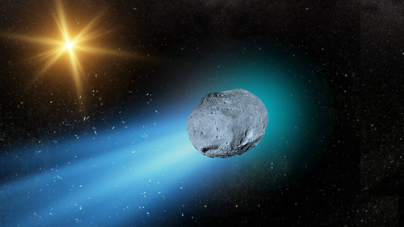 Blisko Ziemi przelatuje obiekt 3I/ATLAS, który jest starszy od naszej części Wszechświata Kometa przemieszczająca się przez przestrzeń kosmiczną z jasnym ogonem, oświetlona światłem pobliskiej gwiazdy, z widoczną chmurą pyłu i gazów wokół jądra kosmicznego obiektu.