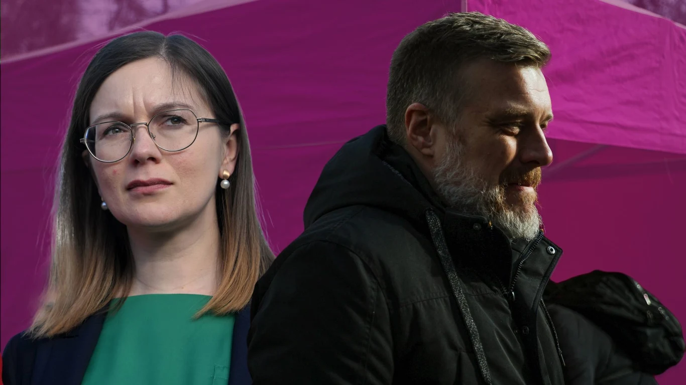 Paulina Matysiak wyrzucona z Partii Razem Dwie osoby na pierwszym planie, kobieta w okularach z poważnym wyrazem twarzy oraz mężczyzna z zarostem ubrany w ciemną kurtkę, tło w odcieniach fioletu.