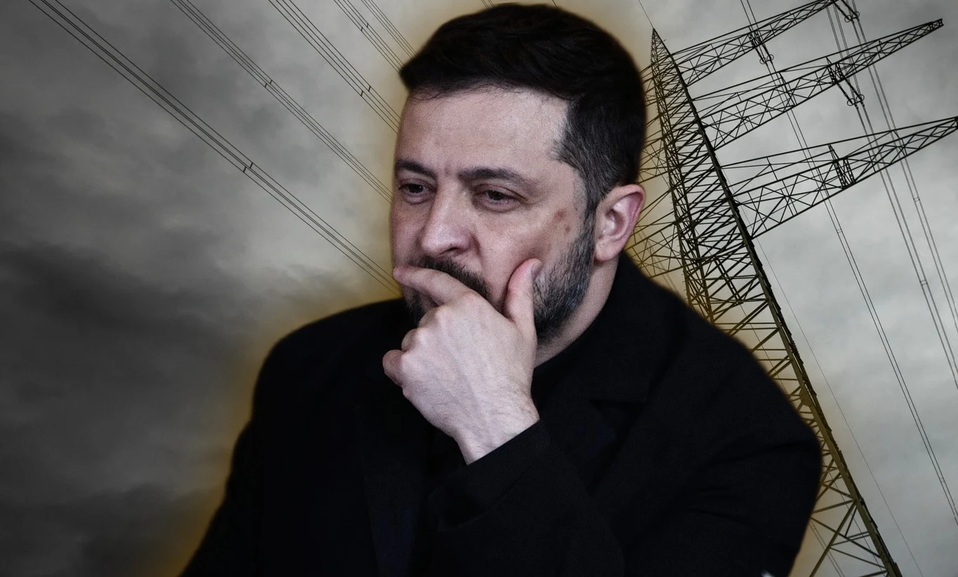 Prezydent Zełenski ma powiązania z osobami podejrzanymi w aferze korupcyjnej wokół spółki energetycznej Enerhoatom Zamyślony Wołodymyr Zełenski w ciemnym ubraniu z ręką przy twarzy na tle wieży wysokiego napięcia i szarych, pochmurnych chmur