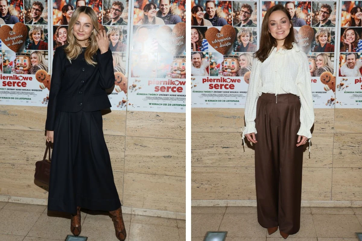 Dwie kobiety pozują osobno na tle plakatu filmowego, obie elegancko ubrane. Jedna z nich ma na sobie ciemny garnitur ze spódnicą do połowy łydki, druga – kremową bluzkę i szerokie brązowe spodnie. W tle liczne kolorowe plakaty promujące film.