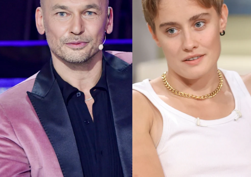 Tomasz Wygoda, Katarzyna Zillmann Portret dwóch osób, mężczyzny w różowej marynarce z czarnym kołnierzem, z mikrofonem przy twarzy, oraz kobiety o krótkich włosach w białej koszulce na ramiączkach i złotym łańcuszku na szyi. Obie osoby patrzą w stronę aparatu.