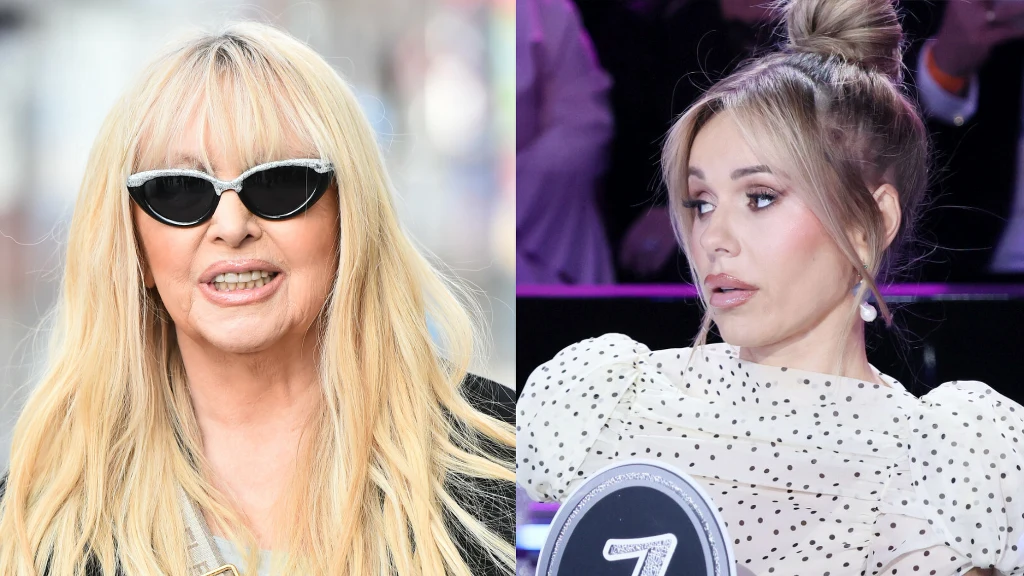 Maryla Rodowicz i Doda. Dwie kobiety, po lewej stronie kobieta w okularach przeciwsłonecznych z długimi blond włosami, po prawej kobieta w jasnej sukience w kropki z upiętymi włosami, trzymająca tabliczkę z liczbą 7.