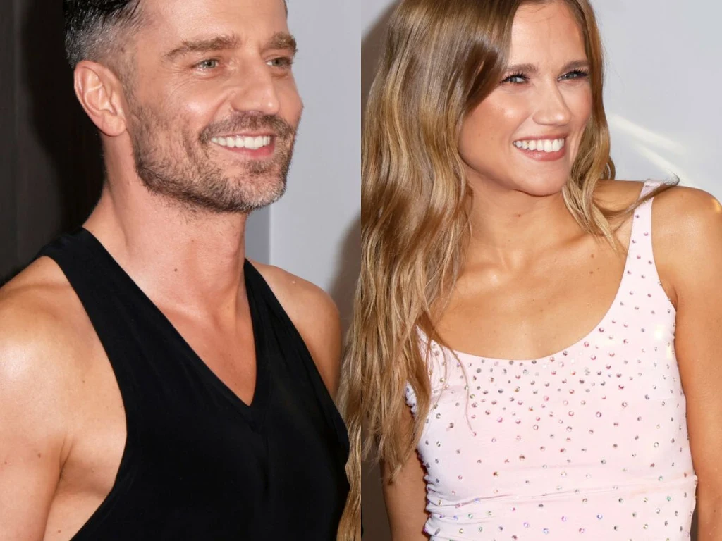 Marcin Rogacewicz, Agnieszka Kaczorowska Para dorosłych osób uśmiecha się, patrząc w kierunku obiektywu. Mężczyzna ubrany w czarną koszulkę, kobieta w jasnej sukience na ramiączkach. Oboje mają zadbane włosy i prezentują pogodny nastrój.