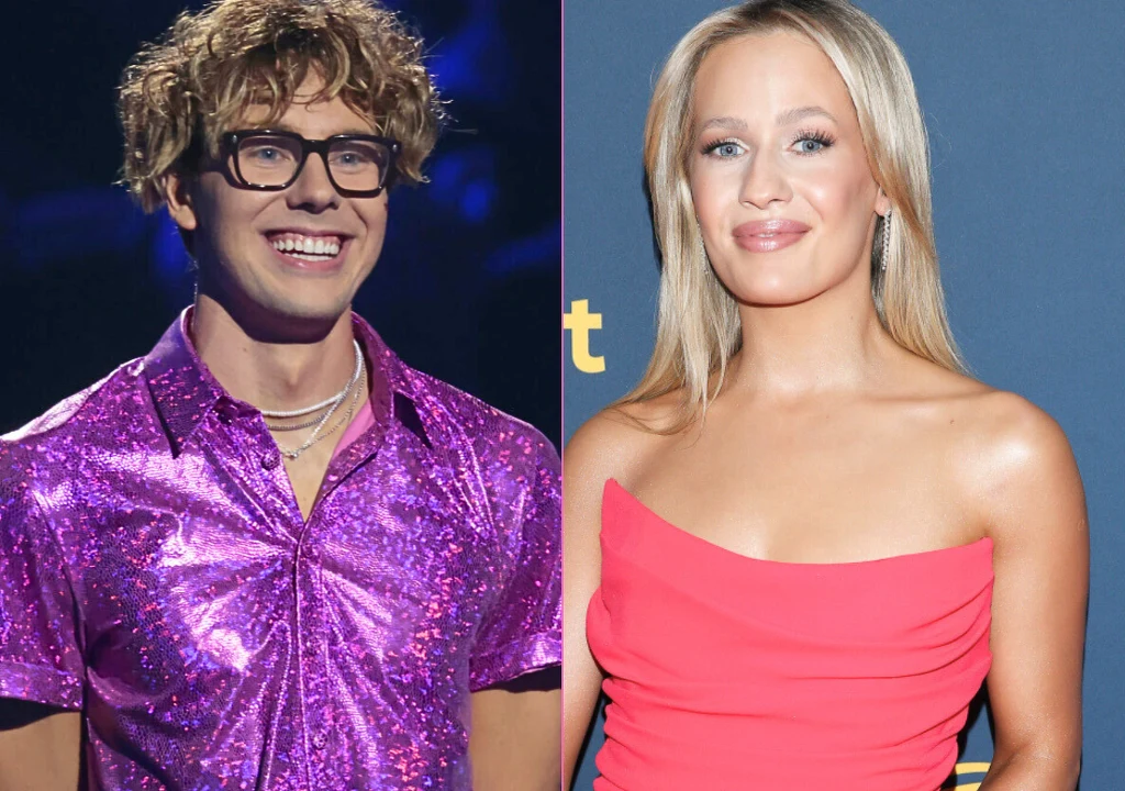 Młody mężczyzna w okularach i błyszczącej fioletowej koszuli stoi uśmiechnięty obok kobiety w czerwonej, eleganckiej sukience na tle niebieskiej ścianki.