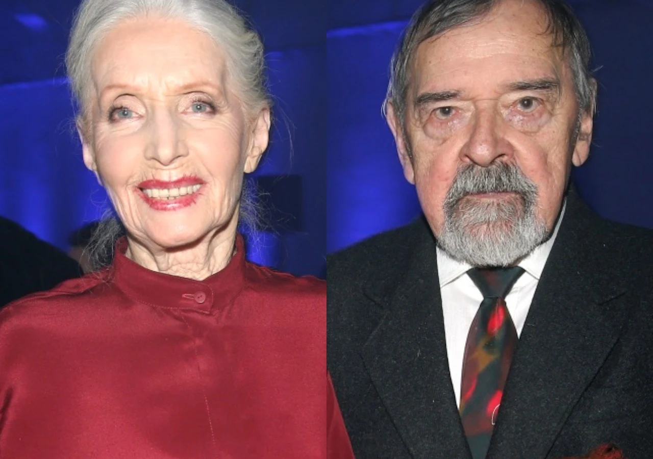 Helena Norowicz, Marian Pysznik Starsza kobieta o siwych włosach ułożonych do tyłu, uśmiechnięta, ubrana w bordową bluzkę oraz starszy mężczyzna z siwą brodą, ubrany w ciemny garnitur i krawat, patrzą poważnie w stronę aparatu. Tło ciemnoniebieskie, oświetlenie studyjne.