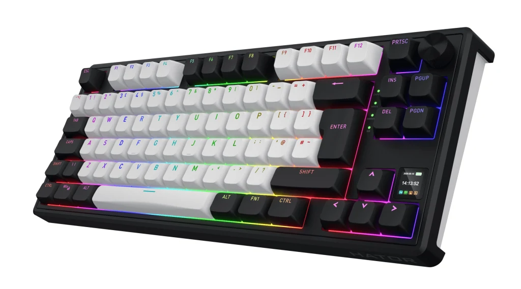 Klawiatura mechaniczna z podświetleniem RGB, klawisze w kolorze białym i czarnym, kompaktowa budowa bez bloku numerycznego, widoczna dedykowana rolka i przyciski multimedialne.