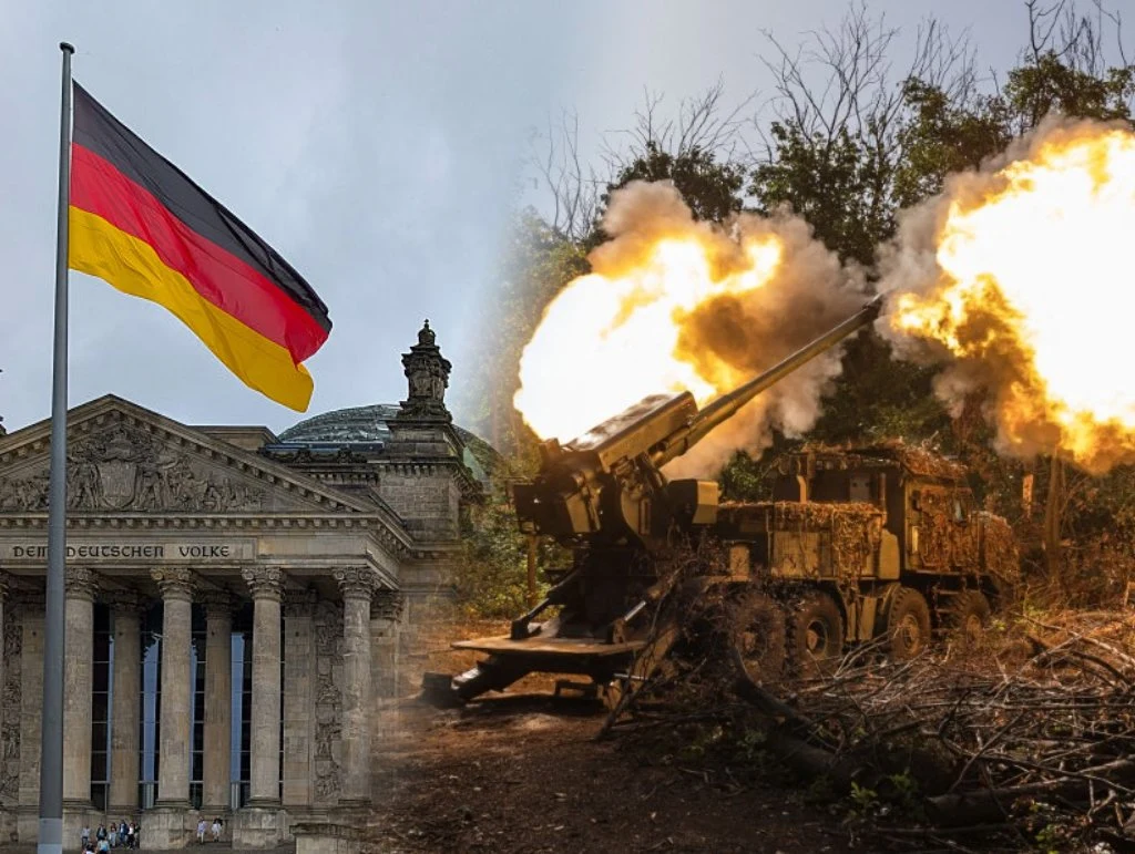 Niemcy. Wysocy rangą oficerowie wojskowi opracowali tajny plan wojny z Rosją Gmach Reichstagu z powiewającą niemiecką flagą po lewej stronie kadru, po prawej stronie widoczna haubica podczas wystrzału w leśnym otoczeniu.