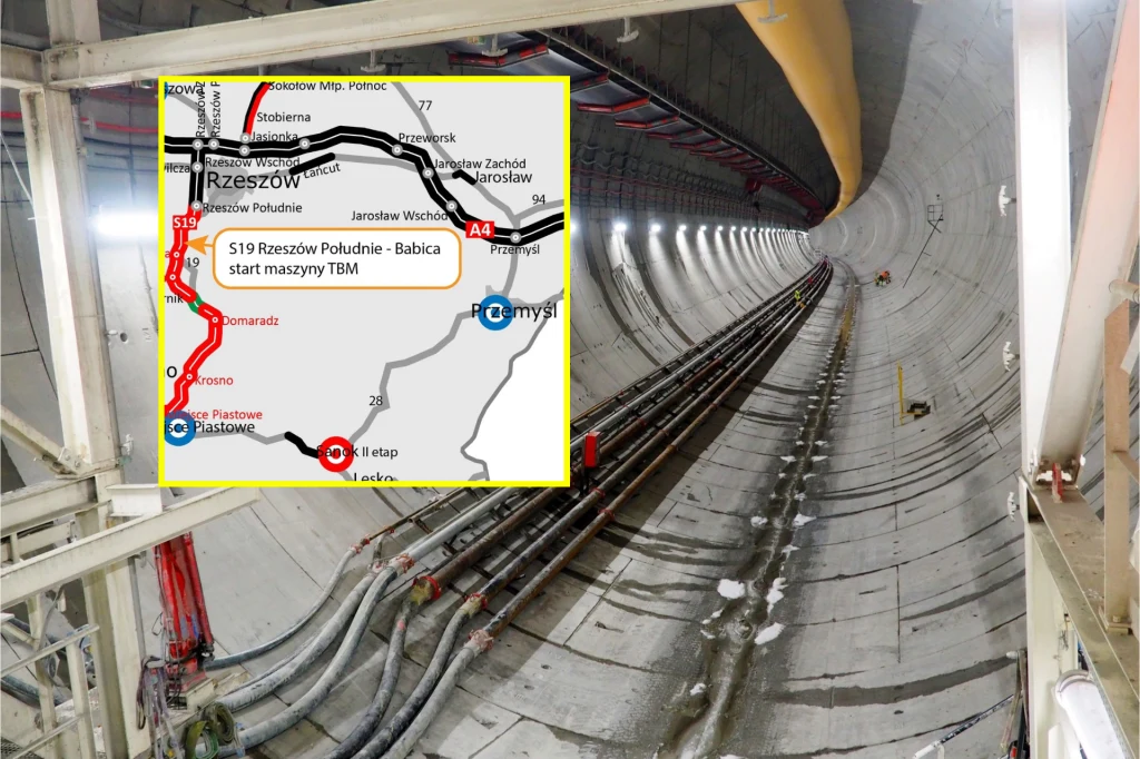 TBM Karpatka powoli kończy drążenie pierwszej nawy tunelu na S19. Wnętrze tunelu z wymalowanymi liniami oraz licznymi przewodami technicznymi po bokach, całość oświetlona sztucznym światłem, w rogu nałożona mapa przebiegu odcinka drogowego S19 ukazująca jego lokalizację i punkty kontrolne.