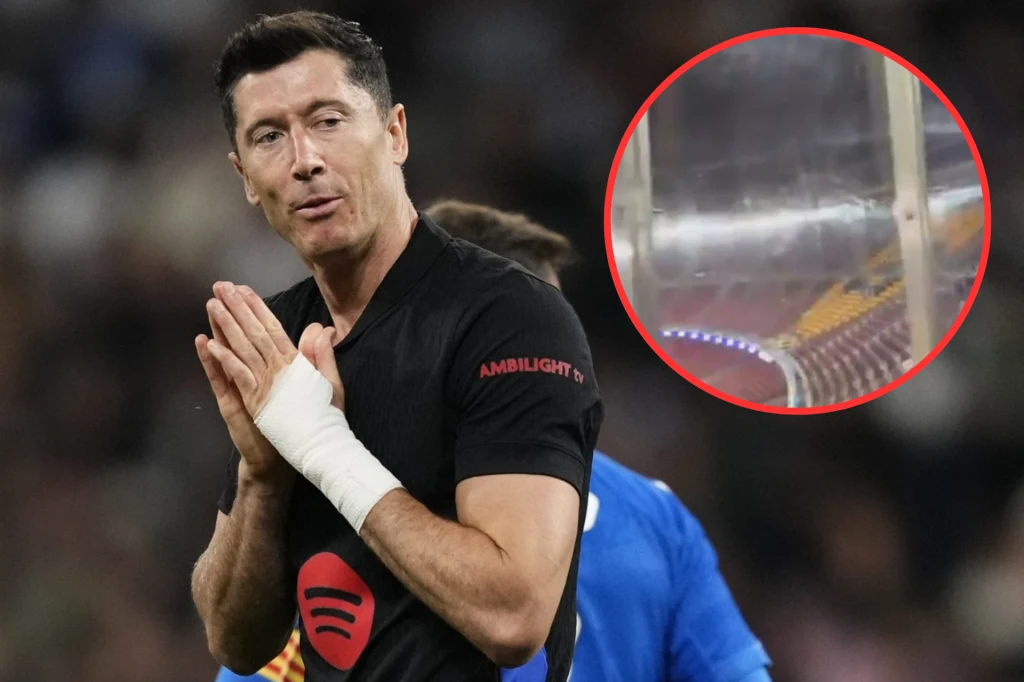 Robert Lewandowski rozgrzewał się przed meczem, gdy kibic Atletico nagrywał filmik z sektora gości Piłkarz w czarnej koszulce z logo Spotify stoi ze złożonymi dłońmi, w tle inny zawodnik oraz rozmyte trybuny, w prawym górnym rogu zdjęcia umieszczony powiększony fragment przezroczystej bariery ochronnej na stadionie.