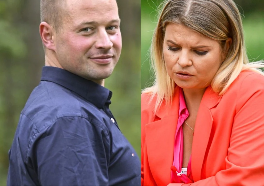 Mężczyzna w granatowej koszuli patrzy w stronę obiektywu z lekkim uśmiechem, kobieta w pomarańczowej marynarce z poważnym wyrazem twarzy spogląda w dół; tło rozmazane, zielone.