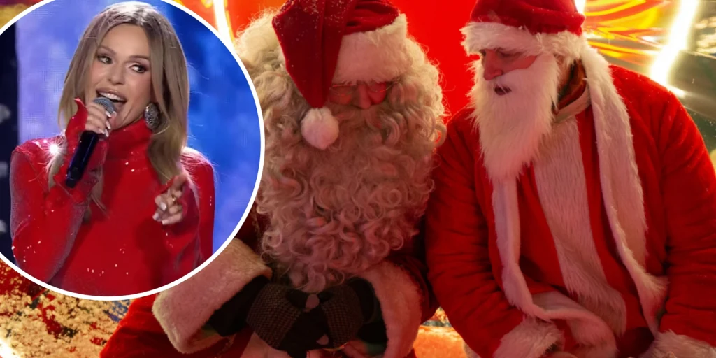 Mikołajki w Polsacie Dwóch Mikołajów siedzi obok siebie, ubranych w tradycyjne czerwone stroje z białymi brodami, przy jasnym, świątecznym oświetleniu. W okrągłej wstawce kobieta w czerwonej sukni śpiewa lub przemawia do mikrofonu.