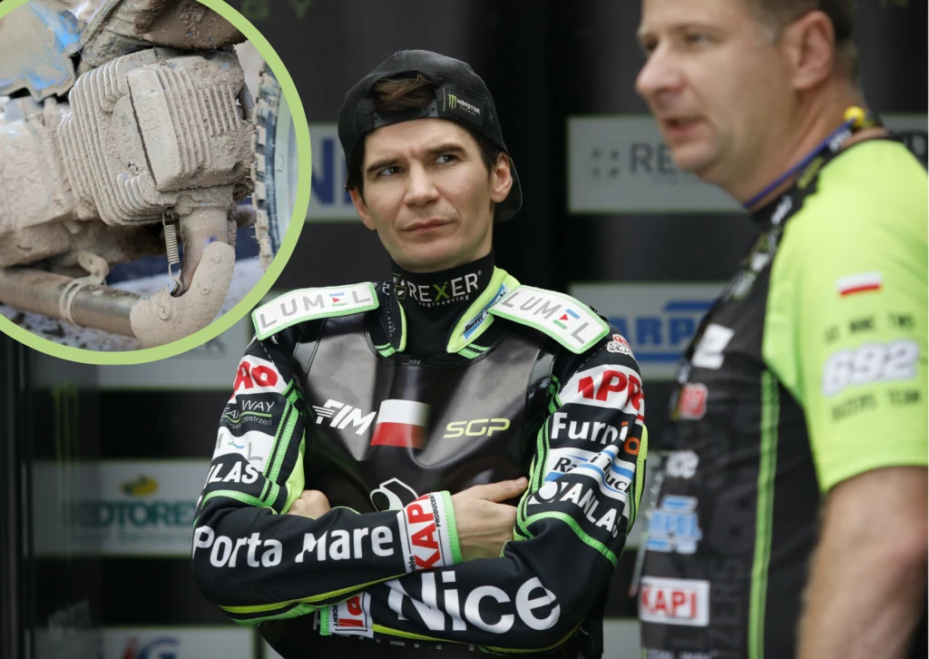 Patryk Dudek zabrał głos ws. ultimatum tunera z Anglii. Zawodnik żużlowy w profesjonalnym kombinezonie z logotypami sponsorów stoi z założonymi rękoma obok członka zespołu w zielonej koszulce. W lewym górnym rogu widoczna jest mała wstawka zbliżenia na zabrudzony element silnika lub motocykla.