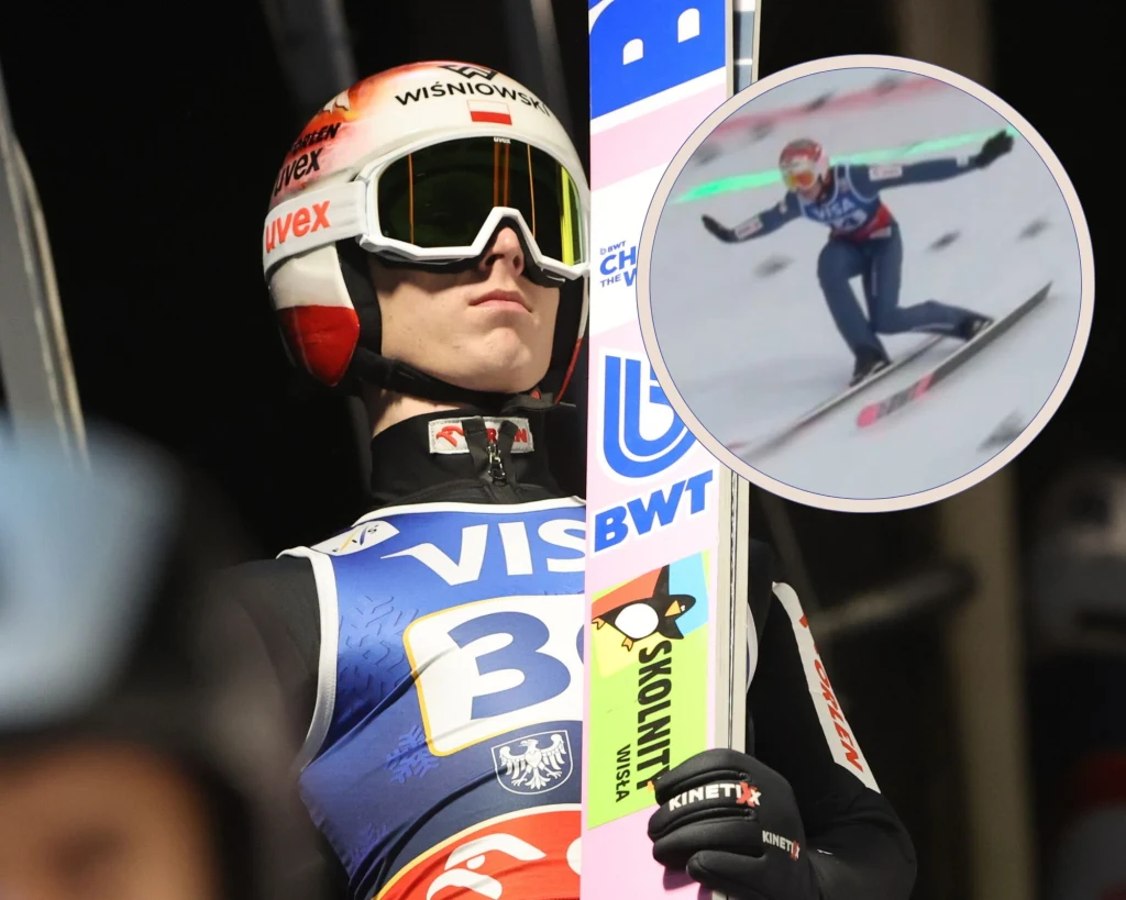 Paweł Wąsek i jego lądowanie Zawodnik ubrany w kombinezon narciarski i kask, gotowy do skoku na skoczni narciarskiej, trzymający narty, w tle widoczne logo sponsorów; w okrągłym kadrze prezentowany moment lotu podczas skoku.