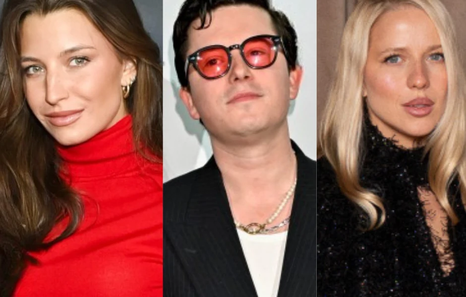 Trzy osoby ustawione w kadrze portretowym, po lewej kobieta z długimi brązowymi włosami w czerwonym golfie, pośrodku mężczyzna w ciemnych okularach i marynarce oraz kobieta o jasnych, prostych włosach w czarnym stroju po prawej stronie.