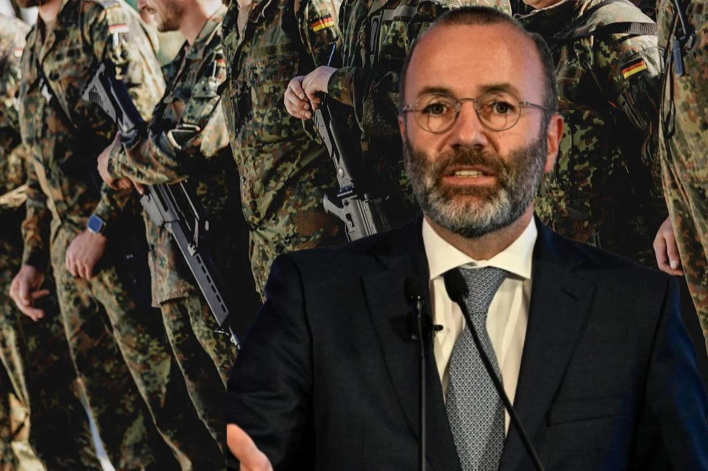 Szef Europejskiej Partii Ludowej Manfred Weber wypowiedział się na temat wysłania europejskich żołnierzy na Ukrainę Mężczyzna w garniturze i okularach stoi na tle żołnierzy w mundurach wojskowych z niemieckimi flagami na ramionach oraz bronią w rękach, wygłasza przemówienie lub udziela wywiadu.