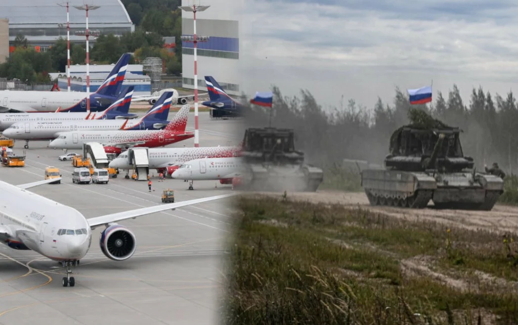 Deportacja z USA do Rosji. Mogą od razu trafić na front Po lewej stronie znajduje się lotnisko z szeregiem zaparkowanych samolotów pasażerskich, głównie linii Aeroflot. Po prawej stronie widoczne są dwa rosyjskie pojazdy opancerzone jadące po piaszczystym terenie, z powiewającymi flagami Rosji; w tle las i ...