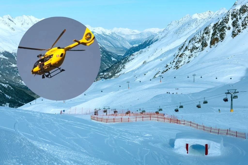 Włochy. Polak zmarł na stoku narciarskim w Livigno Stacja narciarska w zaśnieżonych górach z trasami narciarskimi, wyciągami krzesełkowymi oraz żółtym helikopterem ratunkowym na niebie, sugerującym ewentualną akcję ratunkową.