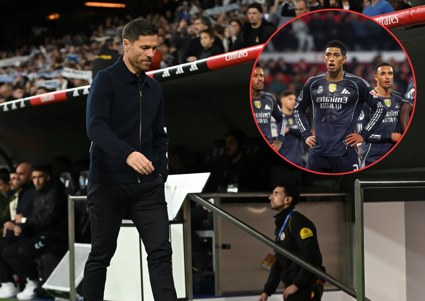 Niektórzy piłkarze Realu Madryt stają w obronie Xabiego Trener opuszczający strefę techniczną na stadionie piłkarskim, w tle widoczna ławka rezerwowych oraz zawodnicy uważnie obserwujący wydarzenia na boisku, podkreśleni w okrągłym powiększeniu.