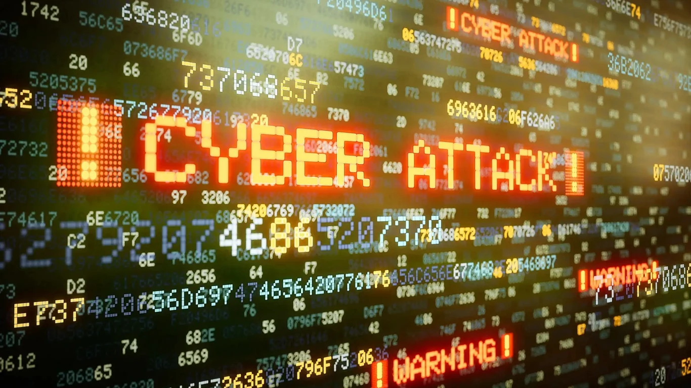 Cyberatak na państwowy urząd. Wykradziono ważne dane Czerwony napis 'CYBER ATTACK' i 'WARNING' wyświetlone na tle kodu komputerowego, otoczone szeregiem cyfrowych znaków, sugerujące zagrożenie atakiem w cyberprzestrzeni.