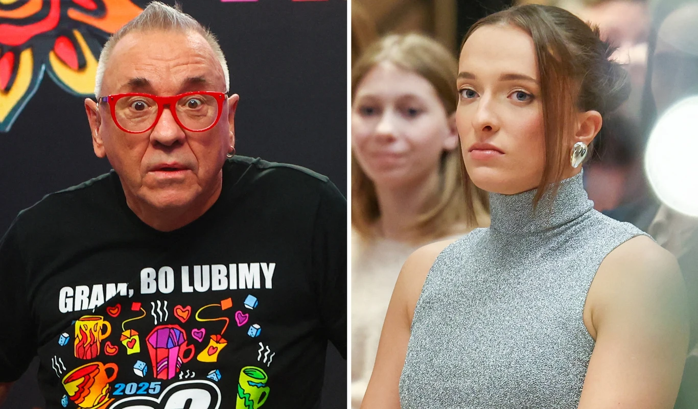 Dwie osoby po lewej stronie starszy mężczyzna w okularach i czarnej kolorowej koszulce z napisem, po prawej młoda kobieta w szarym, bezrękawnym swetrze. W tle rozmyte postacie osób obserwujących.