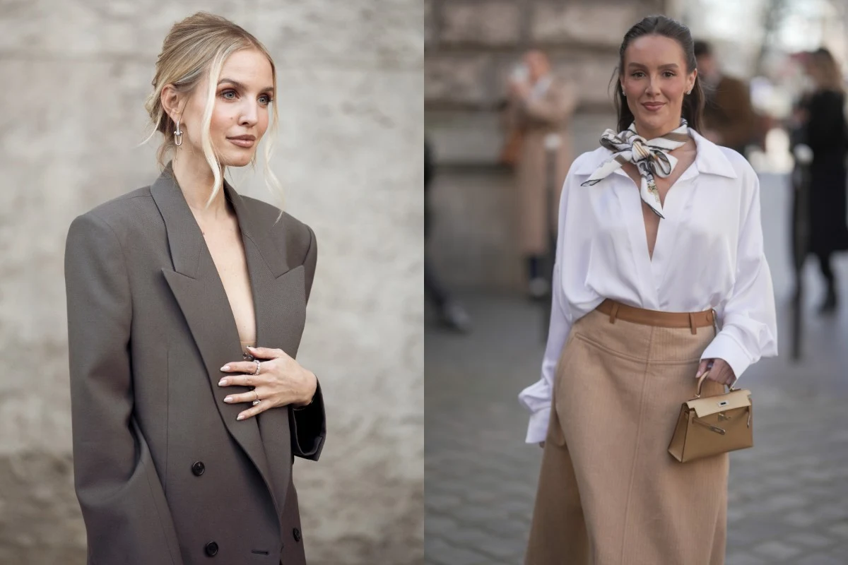 Jak zbudować ponadczasową garderobę? Fot. Raimonda Kulikauskiene, 305pics Dwie kobiety w eleganckich stylizacjach. Po lewej kobieta w szarej, szerokiej marynarce bez widocznego podkoszulka, włosy upięte. Po prawej kobieta w białej koszuli z apaszką przy szyi oraz beżowej, długiej spódnicy, trzymająca jasną torebkę.